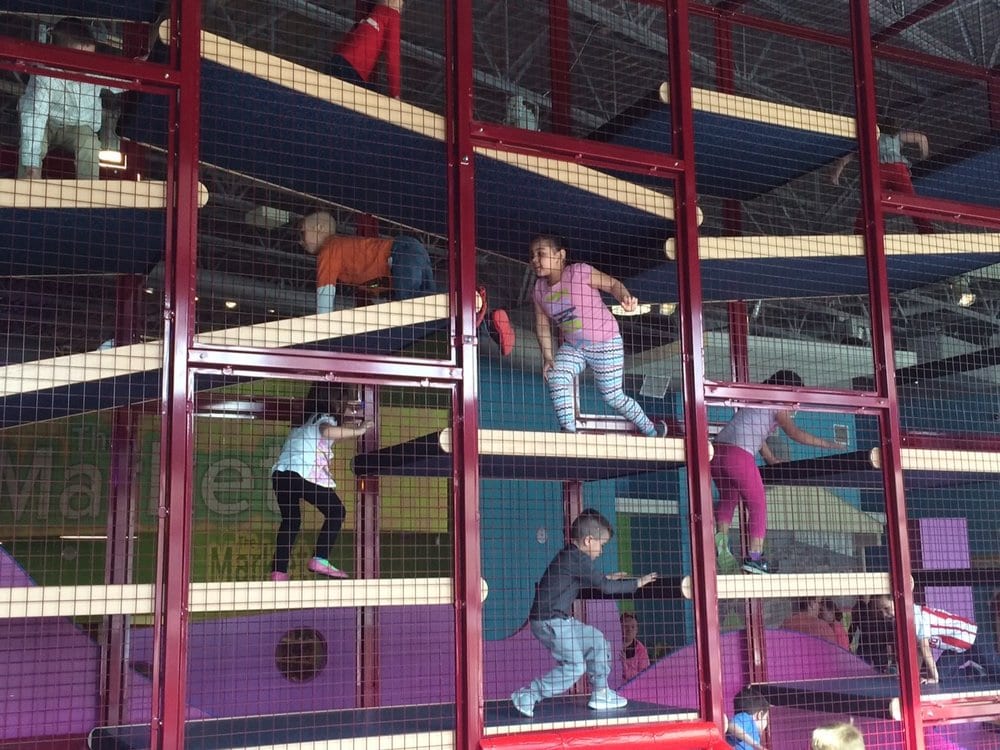 Kids climbing in multilevel climber.
